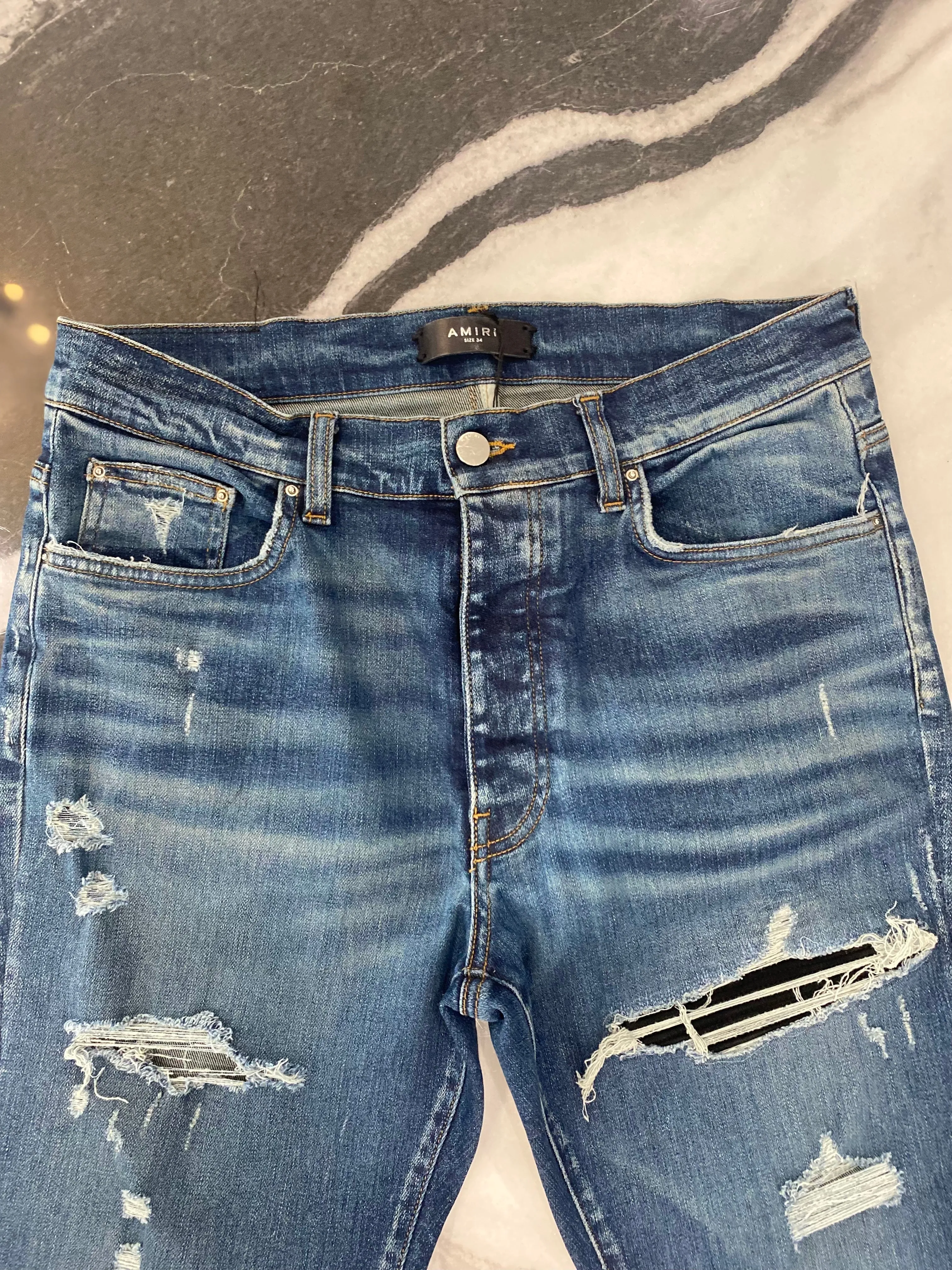 AMIRI MX1 DISTRESSED SKINNY LEG JEANS