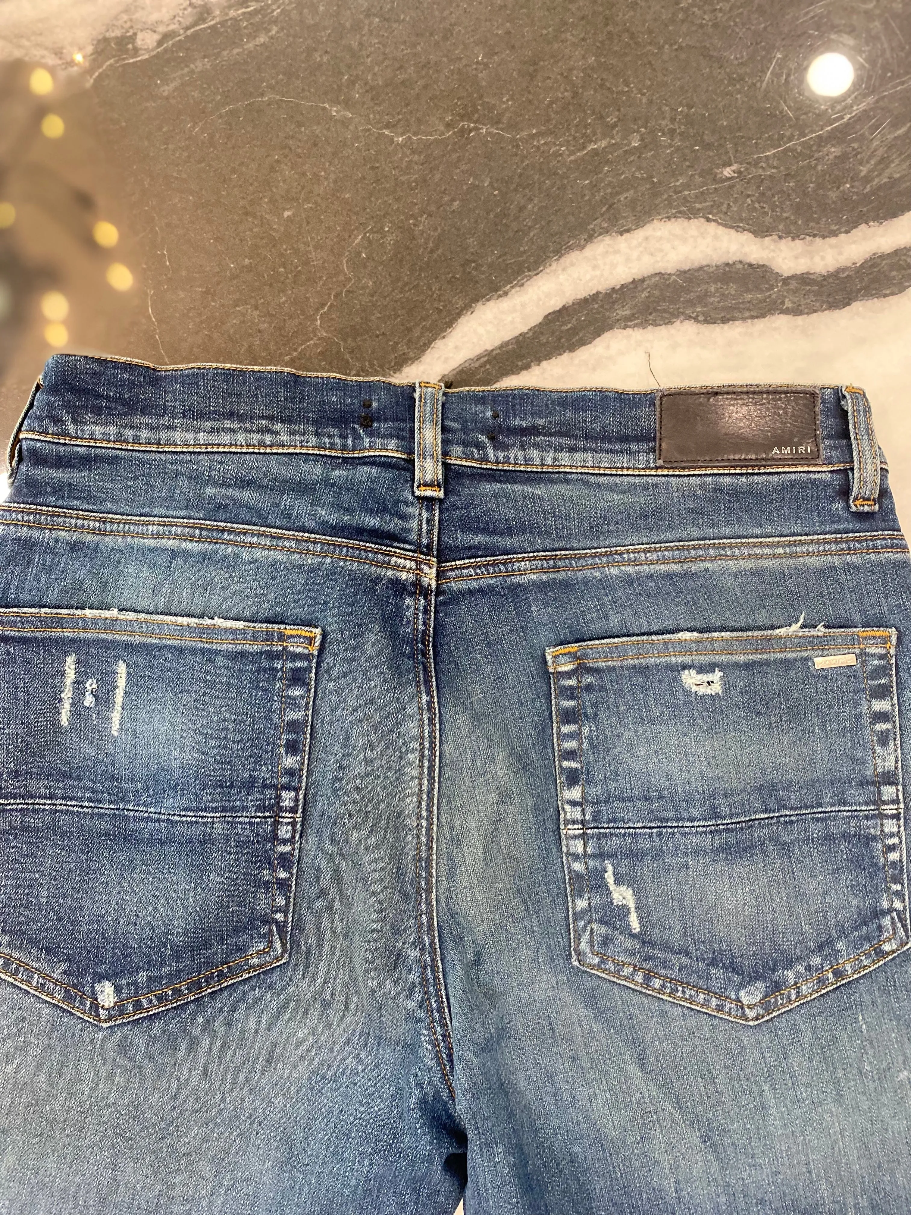 AMIRI MX1 DISTRESSED SKINNY LEG JEANS