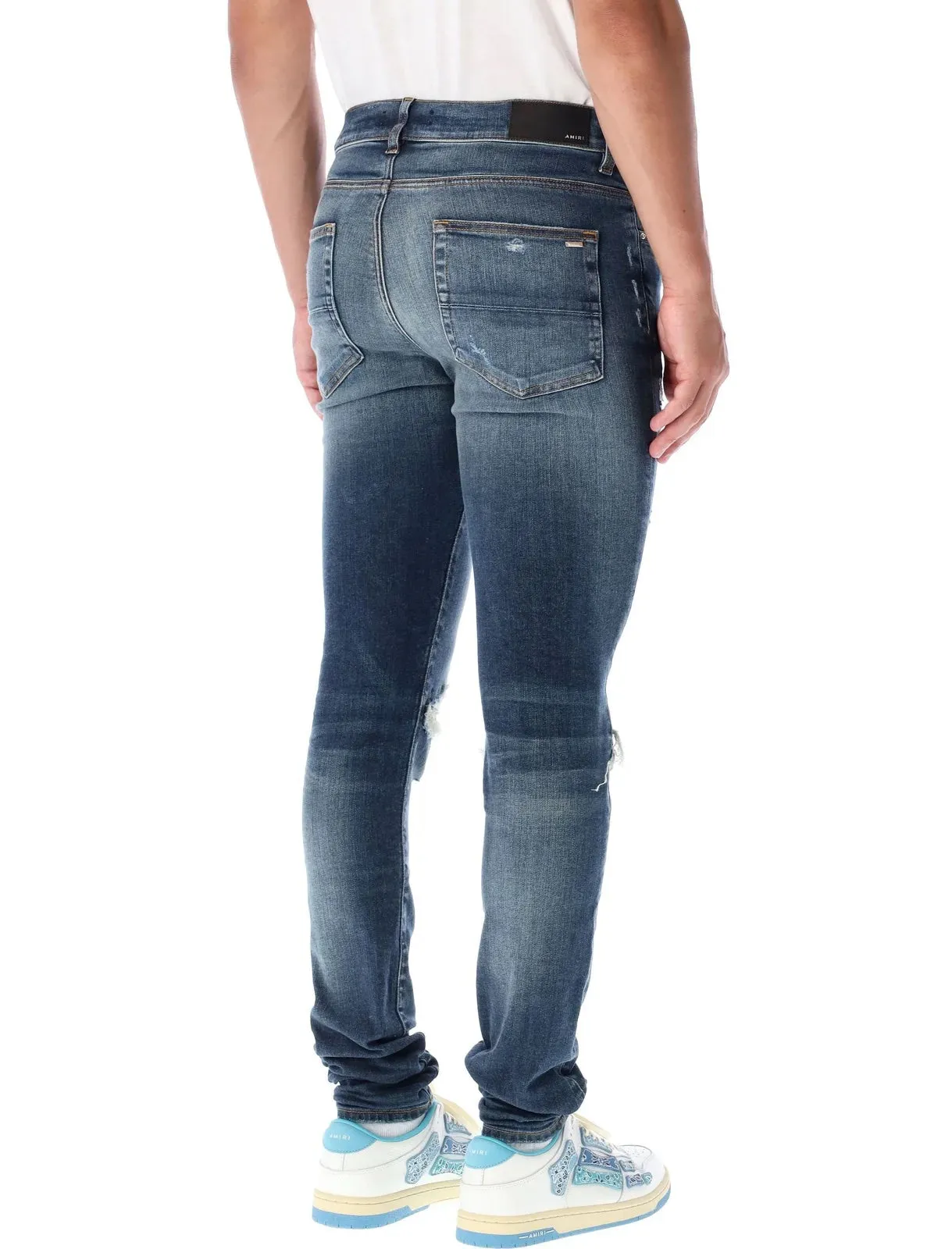 AMIRI MX1 DISTRESSED SKINNY LEG JEANS